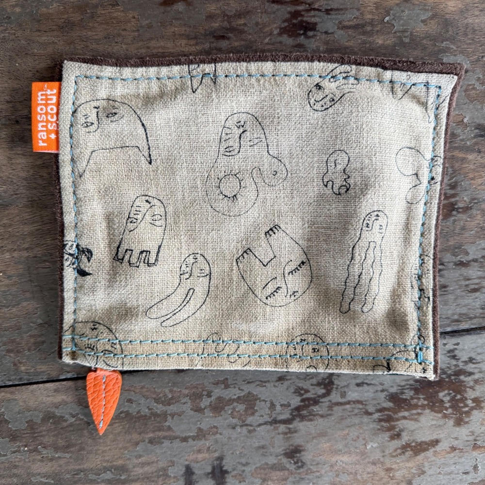 Ransom + Scout Abstract Face Print Linen Zipper Pouch Tan Black Orange Leaf Pull